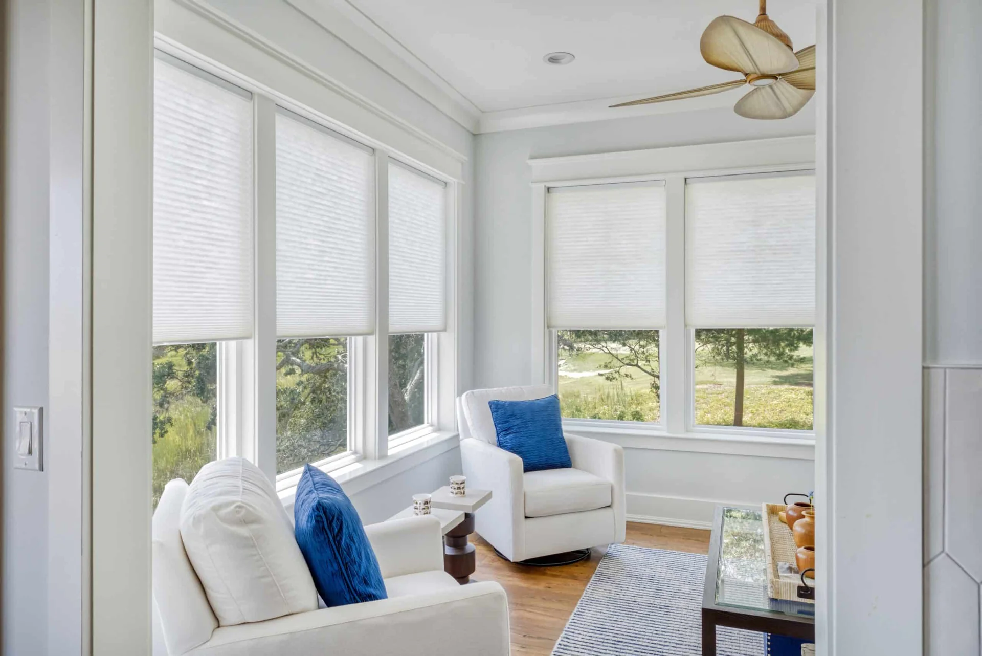 Bright Houston-area sunroom with cordless light-filtering shades and a green yard outside